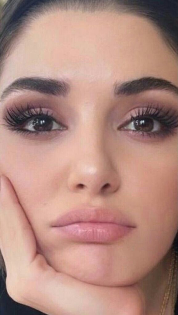 woman Touching Lashes with hands